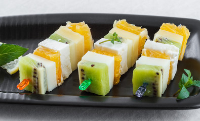 Canape with fruits and cheese