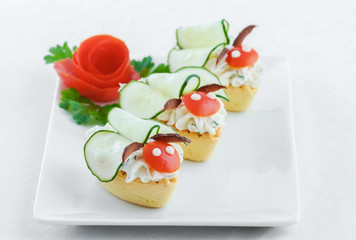Salty mini tartlets stuffed with cream cheese and  vegetable