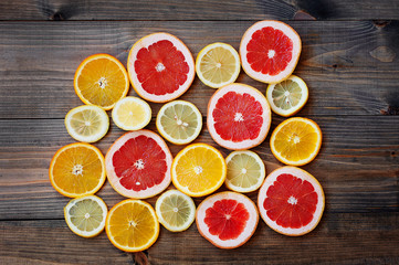 Fototapeta na wymiar grapefruit lemon orange on a dark background