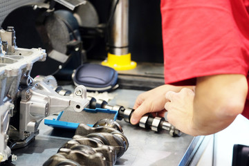 Worker takes camshaft
