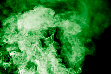 Obraz na płótnie Canvas green smoke on a black background