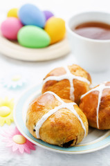Easter buns with a cross and eggs