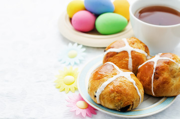 Easter buns with a cross and eggs