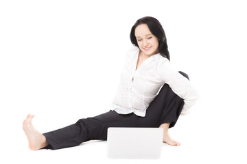 Young office woman with laptop exercising on white background