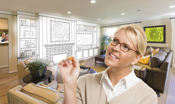 Woman with Pencil Over Custom Room and Design Drawing