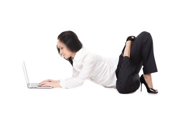 Young office woman lying in yoga pose with laptop, on white back