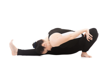 Obraz premium Yogi female in yoga asana Janu Sirsasana