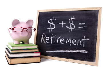 Piggy Bank or piggybank standing next to small blackboard with retirement growth formula pension fund concept photo