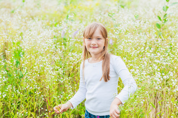 Outdoor portrait of a cute little girl