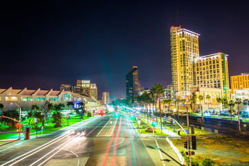 Long exposure of traffic on Harbor Drive and skyscrapers at nigh