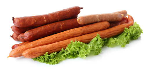 Assortment of thin sausages  with lettuce salad leaves,