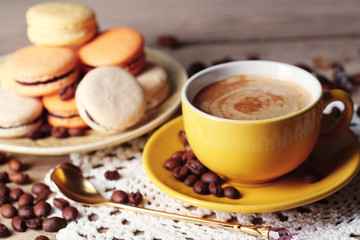 Gentle colorful macaroons and  coffee in mug