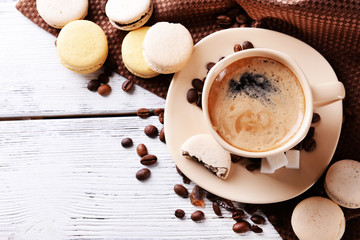 Gentle colorful macaroons and  coffee in mug