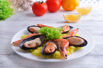 Seafood Paella on plate on table close-up