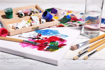 Obraz premium Professional art materials on color wooden background