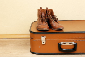 Vintage suitcase with male shoes