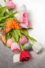 Easter eggs and tulips and butterfly
