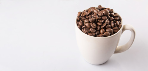 Roasted coffee bean in white mug