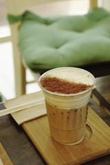 Ice coffee on the timber tray