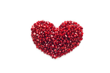 Obraz na płótnie Canvas heart shape from pomegranate seed on white background