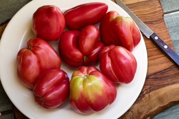 Ripe rose curved tomatoes