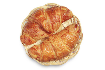 Two tasty croissants in wicker plate