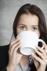 beautiful business woman drinking coffee