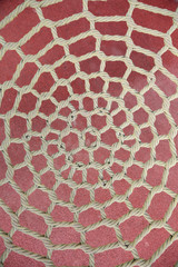 Unusual Yellow rope knotted in park