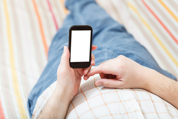 man looking on smart phone with cut out screen