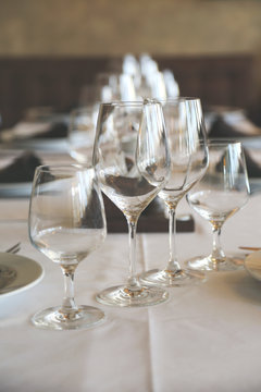 Table in restaurant white tablecloth wine glasses