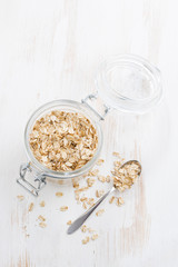 homemade granola in a glass jar, vertical, top view