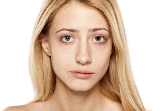 portrait of sad young blonde without make up