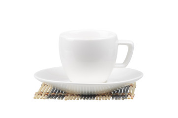 White coffee cup and saucer on a wooden napkin on white - Powered by Adobe
