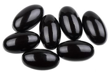 Dietary supplement capsules in black