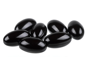 Dietary supplement capsules in black