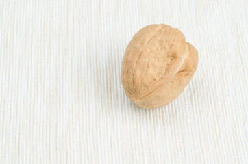 walnut on table cloth, close up