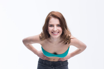 Fototapeta premium Portrait of a smiling woman posing over white background