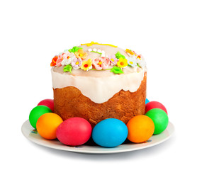 Painted Easter eggs and delicious cupcake on white isolated back