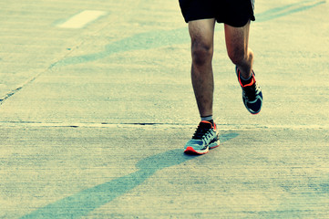 Plakat marathon runner legs running on street