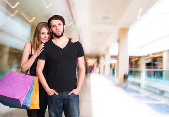 Happy couple with shopping bags