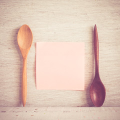 wooden spoons on a wooden background 