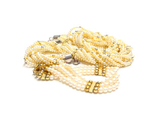 twisted strands of white pearls on a white background