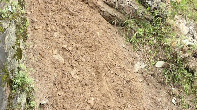 Clearing a landslide on a dangerous mountain road