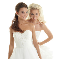 Fototapeta na wymiar Charming models posing in wedding dresses