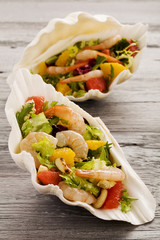Shrimp salad with grapefruit, orange and roasted peanuts. - Serv