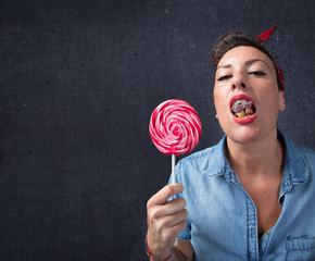 uneducated woman eating lots of candy