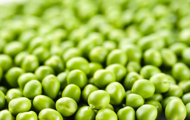 Peas. Green background. Soft focus