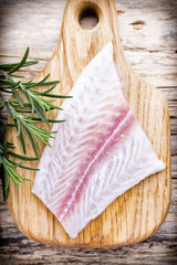 Fish fillet in spices and rosemary.