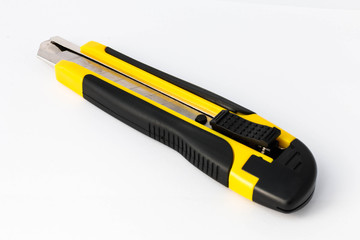 Yellow paper knife isolated on white background