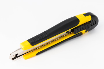 Yellow paper knife isolated on white background